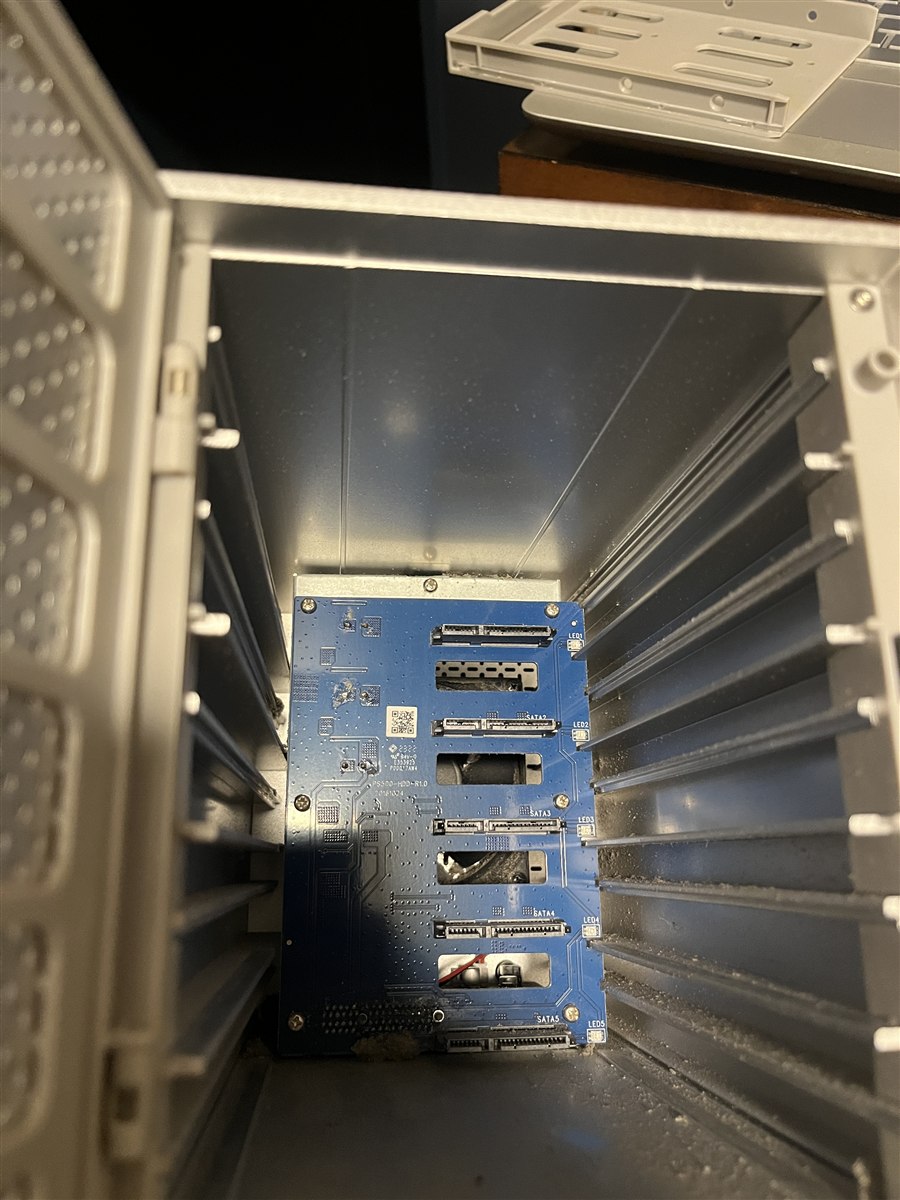 Inside the Yottamaster PS500 — the SATA backplane connecting five 4TB drives. The enclosure has been reliable; the cables have not.